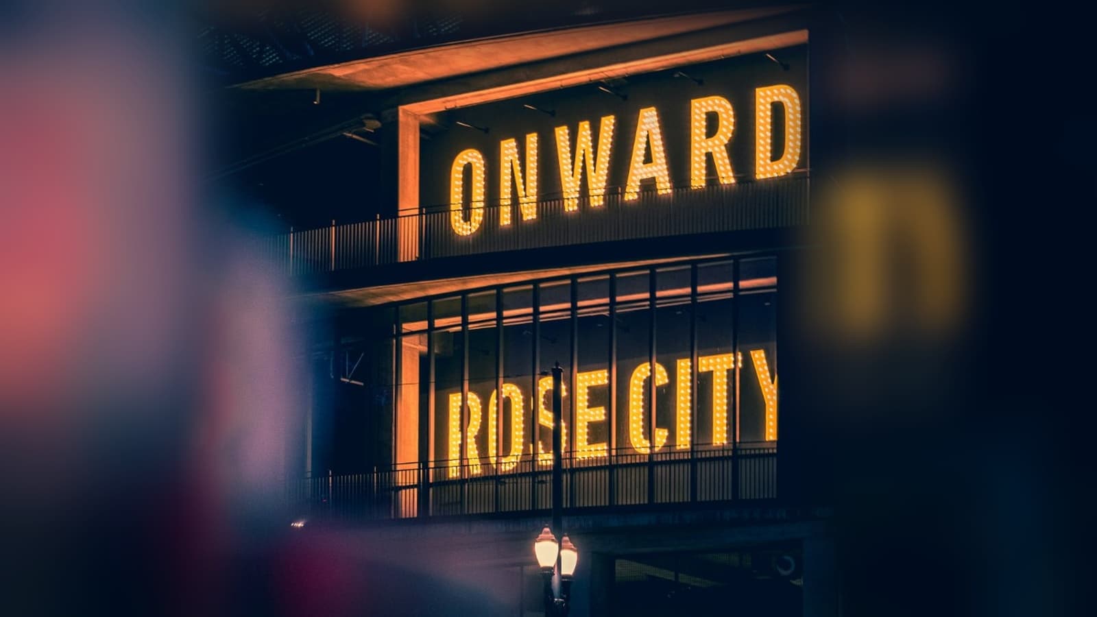 Providence Park marquee at night — ONWARD and ROSE CITY in lights